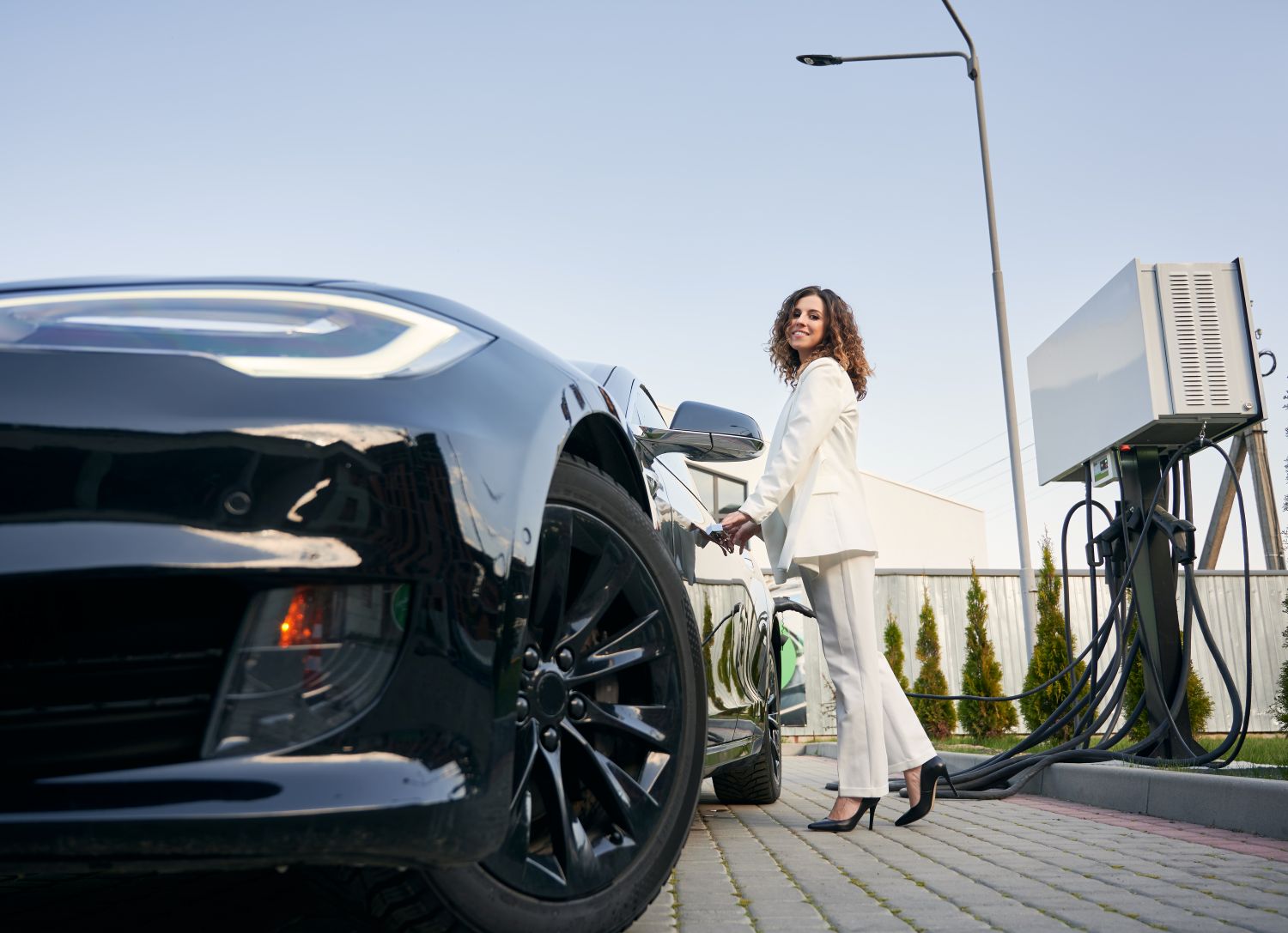 woman charging EV